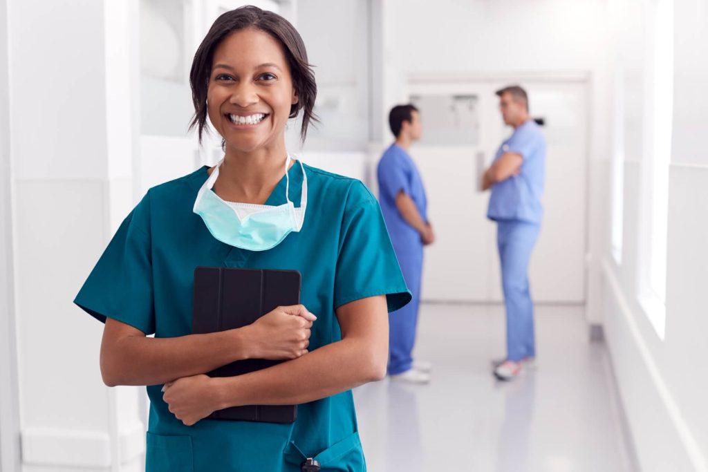 smiling female doctor wearing scrubs