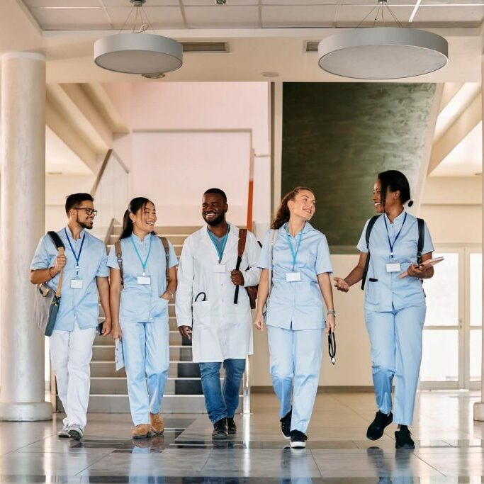 multi-ethnic group of happy medical students walking